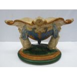 A large Majolica  centrepiece  bowl raised on two sphinx supports, 22 x  35cm.