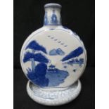 A large Chinese blue and white moon flask decorated with pagodas in landscape, 26cm, together with a