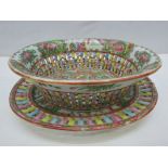 A reproduction Chinese Famille Rose pierced oval bowl and stand, diameter 23cm oval, having 'Made in