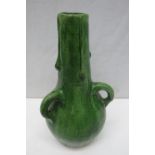 An Art Nouveau green glazed three handled tyg vase. 25cm.