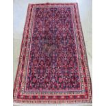 A Hamadan rug on red ground with pattern