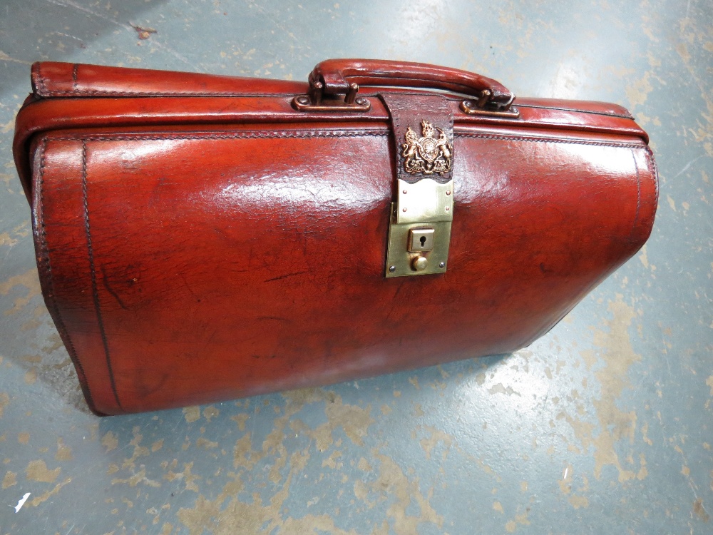 A leather briefcase with brass lock and