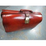 A leather briefcase with brass lock and