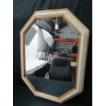 An octagonal bevel edged wall mirror wit