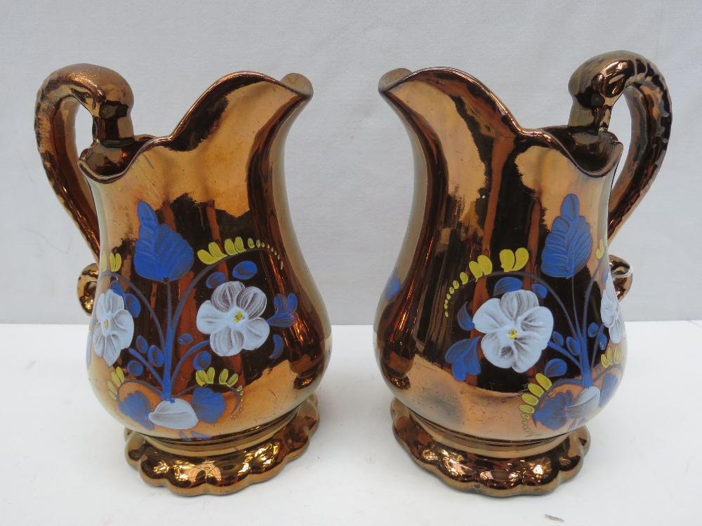 A pair of Sunderland lustre jugs, 18cm.