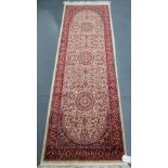 A beige ground Keshan runner 210cm x 70c