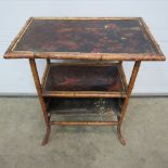 A 19thC bamboo side table of Oriental in