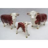 A Beswick Hereford trio comprising bull,