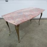 A c1960's marble top coffee table raised