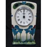 A Moorcroft clock with blue heaven desig