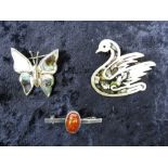 Three white metal brooches; one marked 9