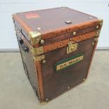 An Army and Navy leather travel trunk wi