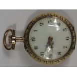 A gold fob watch. A small fob watch with