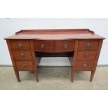 An Edwardian barrel fronted mahogany sho