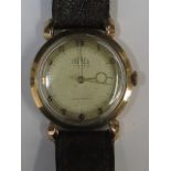 A gent's Trebex strap watch, 9ct gold ca