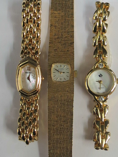 Three ladies yellow metal bracelet watch