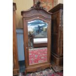 A Continental walnut armoire wardrobe, b