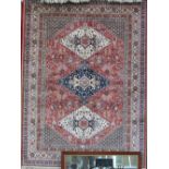 A tan ground caucasian rug, 190cm x 140c