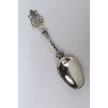 An antique large bowl spoon cast handle