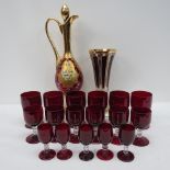 A red Venetian glass decanter with gIlt