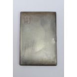 An HM silver cigarette case opening to r