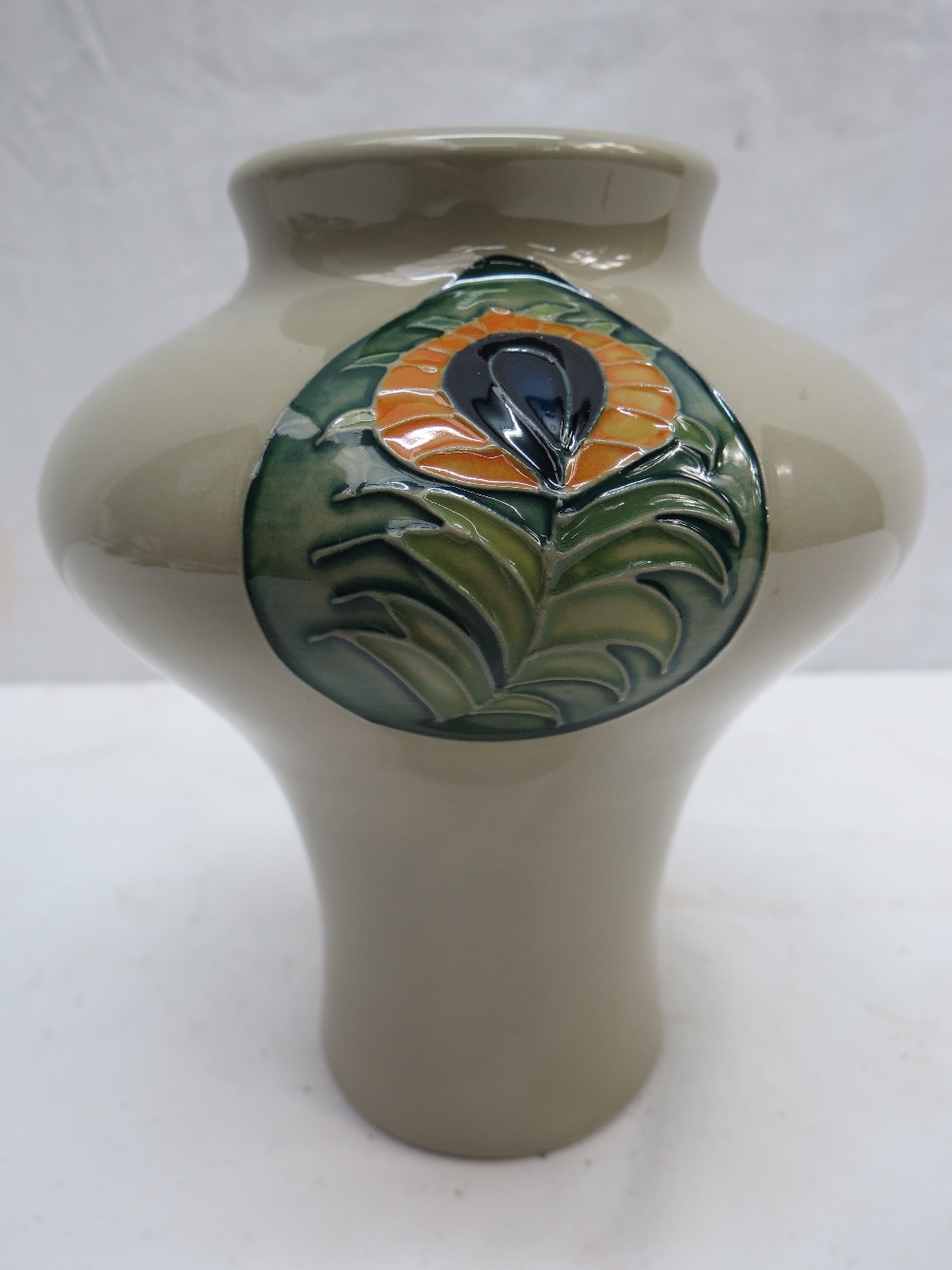 A Moorcroft vase with Peacock Feather design, 16cm