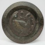 An Oriental bronze embossed plaque decor