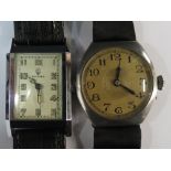 Two gents watches. A round dial strap wa