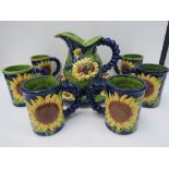 A Majolica style sunflower decorated jug