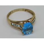 A single stone blue topaz ring with bagu