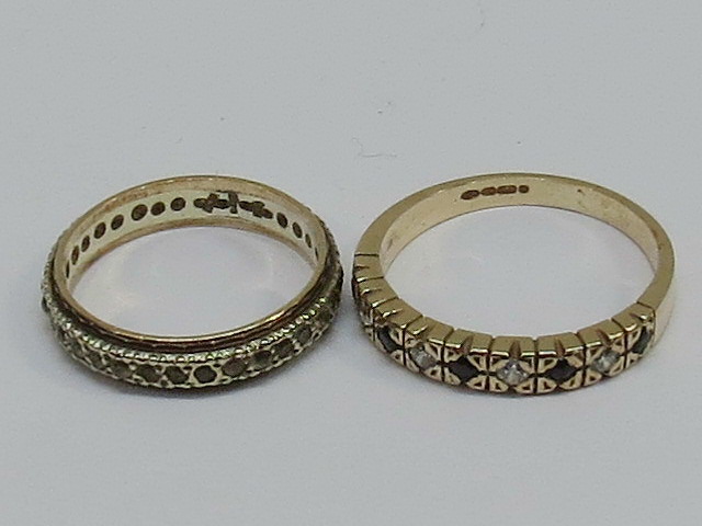 Two 9ct rings; a white and yellow full e