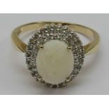 An oval opal cabachon ring, claw set wit