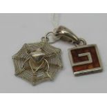 A Greek key shaped square pendant set wi