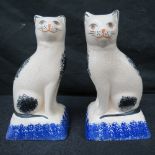 A pair of reproduction Staffordshire cat