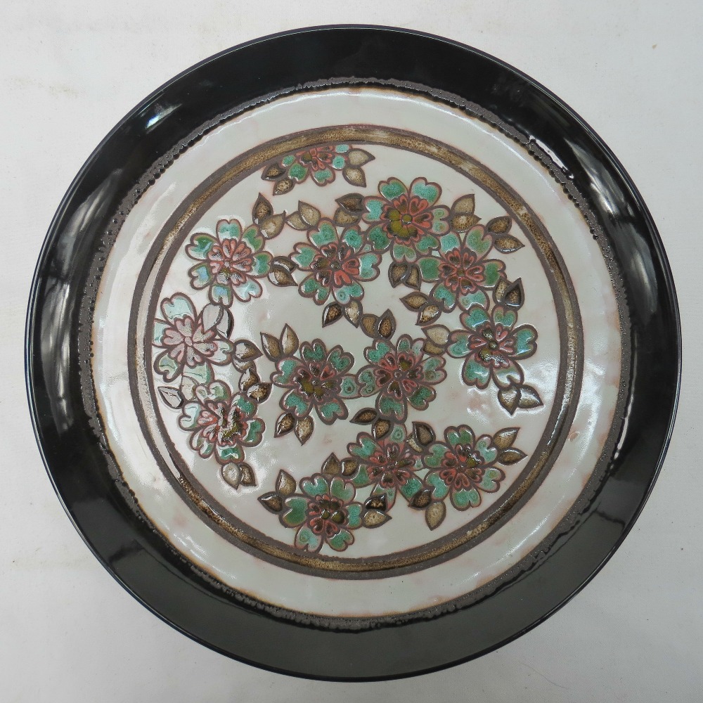 A Poole pottery Ionian charger by T D Tr