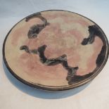 A turned mineral platter with hand appli