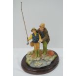 A Heredities 'Angling' ceramic figure gr