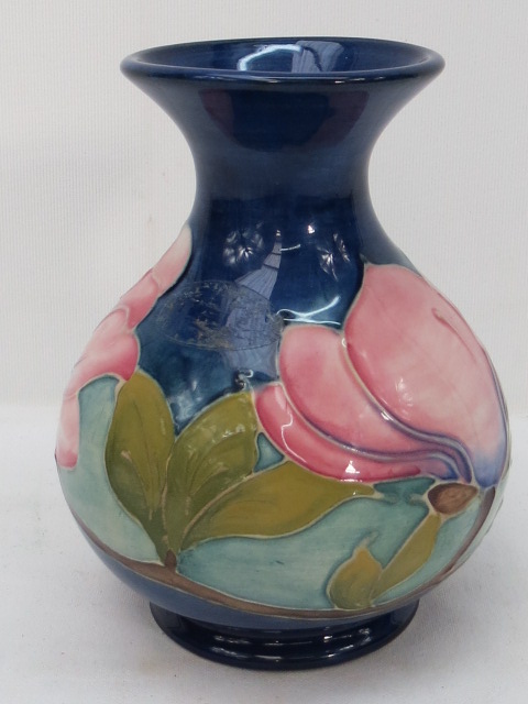 A Moorcroft Magnolia on blue ground vase