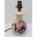 A Moorcroft table lamp with magnolia des