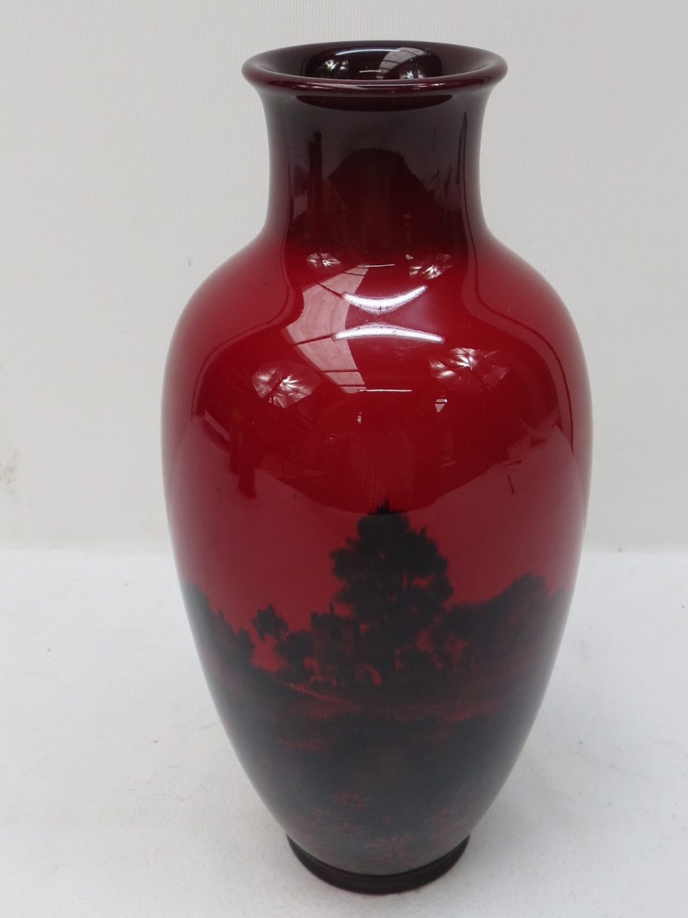 An early Doulton flambe vase with scenic