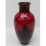 An early Doulton flambe vase with scenic