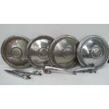 Automobilia. Four Morris Minor hubcaps c