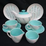 A Poole pottery freeform nine piece tea