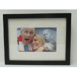 A framed photograph of Ronnie Biggs and female friend, from Carlton Court House following his