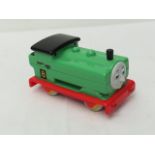 A model of 'Percy' from Thomas the Tank Engine series, signed by Bruce Reynolds and Ronnie Biggs.