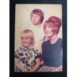 A photographic print of Ronnie Bigg's family given to him by Charmian, from nursing home Carlton