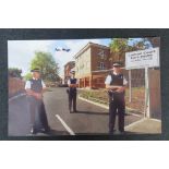 A photograph of Carlton Court Care Home being guarded by Police, signed by Ronnie Biggs.