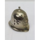 A bell in the form of a policeman's helmet, signed by Ronnie Biggs.