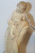 A 19TH.C.ORIENTAL IVORY FIGURE BOY RIDING A CARP