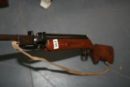 AN AIR RIFLE WITH MAGAZINE FED LOADING